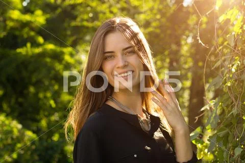 Young woman touching her hair Stock Photos