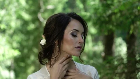 Young woman touching herself in forest Stock Footage