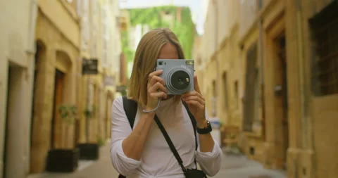 Young woman travel in europe with instant camera Stock Footage 162317815