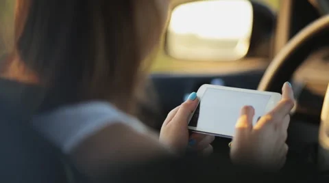 Young Woman Typing A Message While Driving Stock Footage 51427825