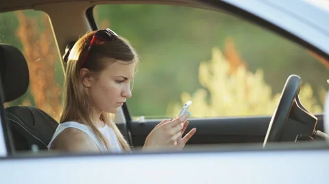 Young Woman Typing A Message While Driving Video stock 51428265