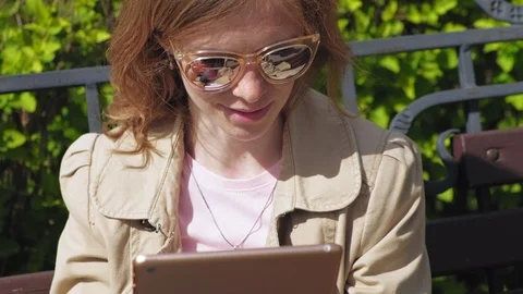 A young woman uses a computer tablet. Remote business concept Video stock 108352992