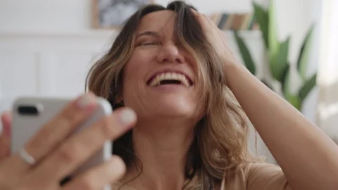 Young woman uses front camera of telephone mobile Stock Footage 127134853