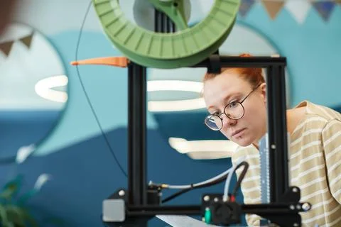 Young Woman using 3D Printer Stock Photos