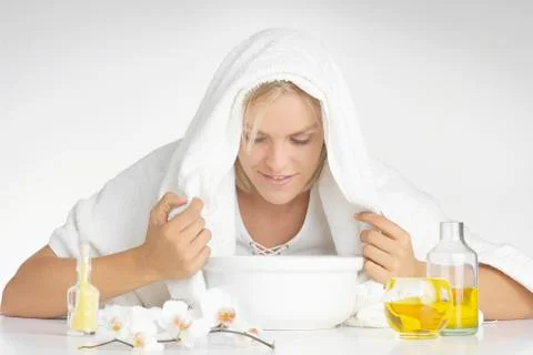 Young woman using aromatherapy oil, close up Stock Photos