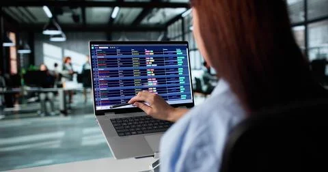 Young Woman Using Billing Software To Analyze Medical Coding Records. Female  스톡 사진