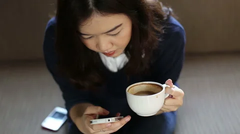 Young woman using cell phone in a cafe Stock Footage 48061481