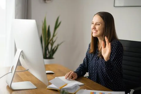 Young woman using computer app for video communication Foto stock