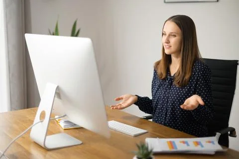 Young woman using computer app for video communication Stock Photos