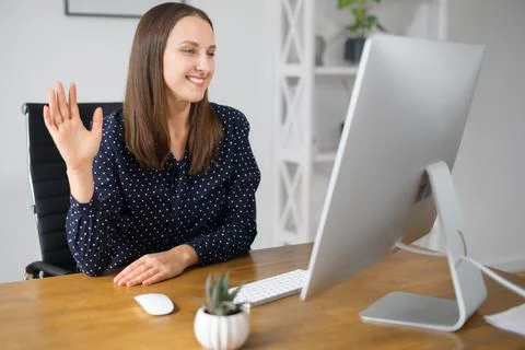 Young woman using computer app for video communication Stock Photos