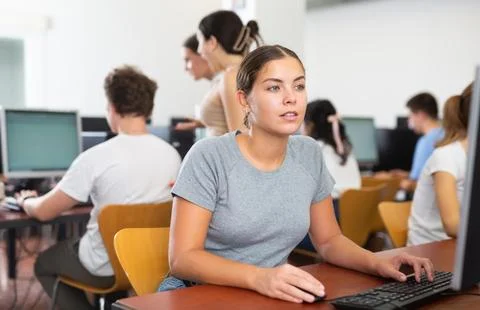Young woman using computer in classroom 写真素材