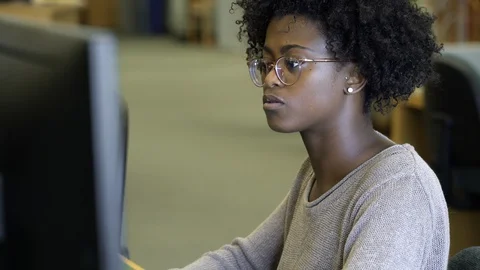 Young woman using computer in college. 動画素材 88015864