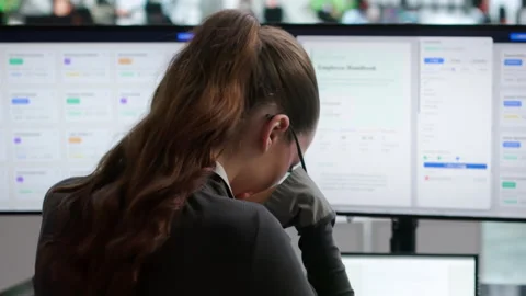 Young Woman Using Computer To Organize Documents Stock Footage 343889205