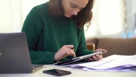 Young woman using digital tablet Stock Footage 75412907