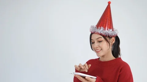 Young woman using digital tablet on a white background (christmas concept) Stock Footage 97367132