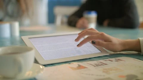Young Woman Using Digital Tablet Ipad Computer In Cafe Stock Footage 97582067