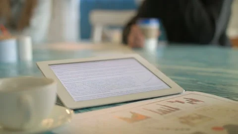 Young Woman Using Digital Tablet Ipad Computer In Cafe Stock Footage 97582378