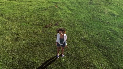 Young woman using drone at sunset for photos and video making - Happy girl Stock Footage 246545336