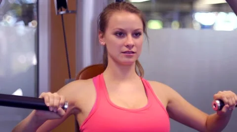 Young Woman Using Exercise Equipment Stock Footage 5517221
