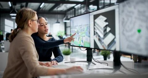Young Woman Using GIS Mapping Tool To Analyze Urban Real Estate. Stock Photos