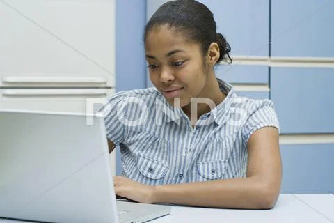 A young woman using her laptop Stock Photos