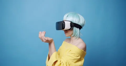 An young woman is using innovative technology vr glasses for play games. Stock Footage 235295587