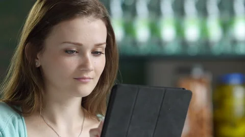 A young woman using an ipad/tablet, close up Stock Footage 51443685