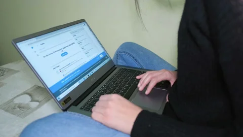 Young Woman using laptop for checking twitter news and smart working,covid19 Stock Footage 143118568