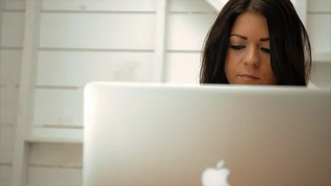 Young woman using a laptop computer. 스톡 동영상 88404252