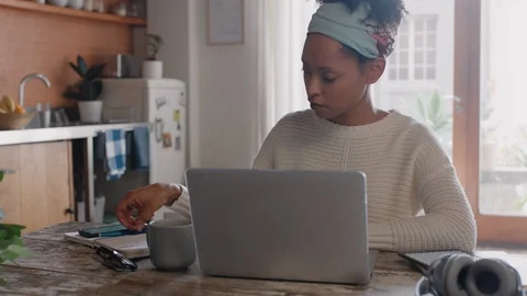 Young woman using laptop computer working from home student brainstorming Видео 103494560