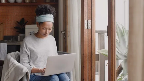Young woman using laptop computer working from home student brainstorming ideas Stock-Footage 103495264