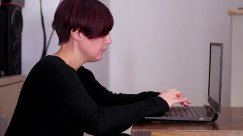 Young woman using laptop computer for remote working Stock Footage 167368925