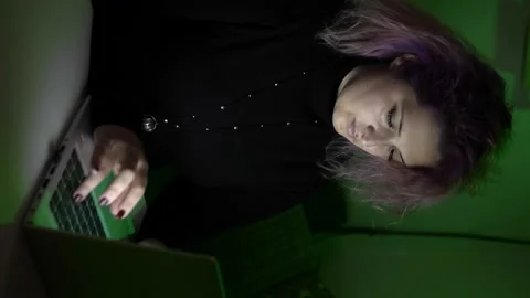 Young woman using laptop computer for remote working. Vertical video Stock Footage 167371075
