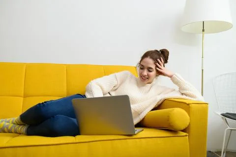 An young woman is using laptop computer for remote work or studying online Stock Photos