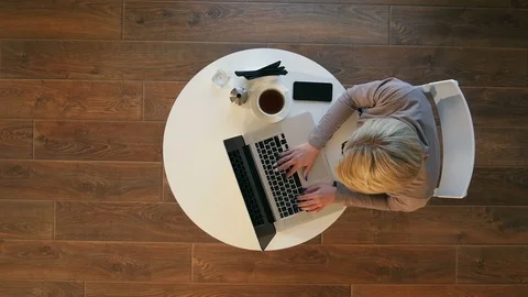 Young woman using laptop while sitting at cafe Stock-Footage 78728654