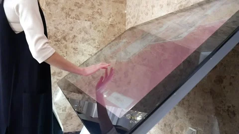 A young woman using a large touch screen of interactive museum Stock Footage 302102976
