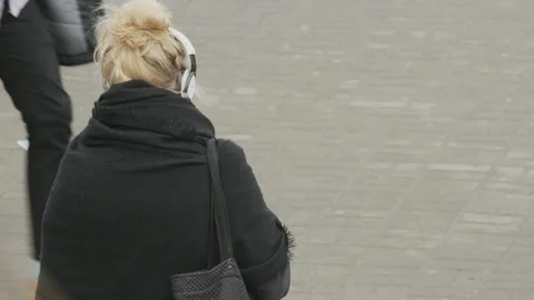 Young Woman Using a Mobile on the Pavement Stock Footage 88097733