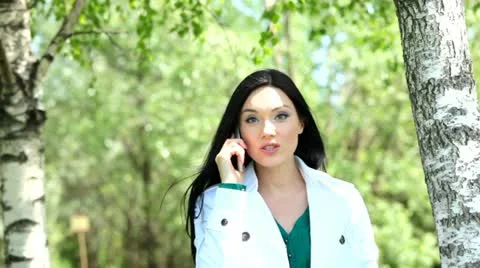 A young woman using a mobile phone 動画素材 11128660