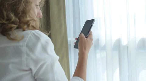 Young Woman Using Mobile Phone Indoors Видео 59303803
