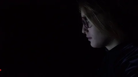 Young woman using notebook at night, close-up Video stock 83635147