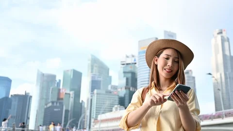 Young woman using the phone to operates 3d virtual reality display in city Stock Footage 123926742