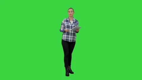 Young woman using reading presentation from a tablet on a Green Screen, Chroma Stock Footage 73862050