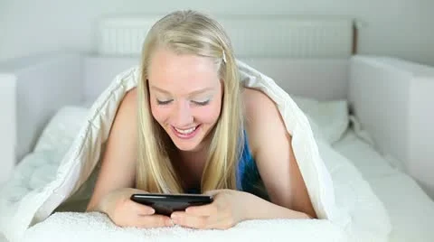 Young woman using a smart phone Stock Footage 24657182