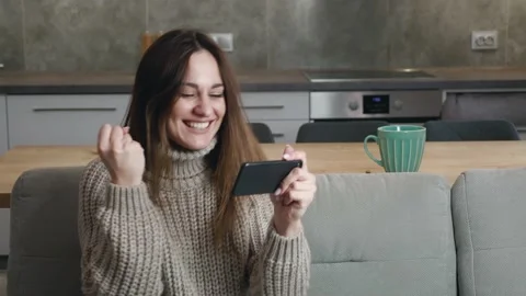 Young woman using smartphone browsing online reading social media messages Stock Footage 146097899