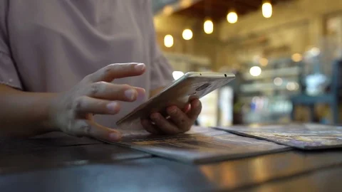 Young woman using smartphone in cafe. Stock Footage 78993753