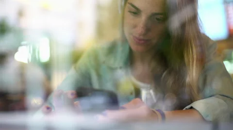 Young woman using smartphone Stock Footage 63300399