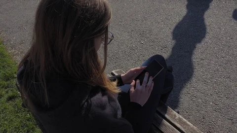 Young woman using smartphone Stock Footage 74184861