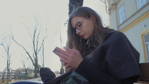 Young woman using smartphone Stock Footage 74186716