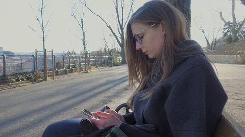 Young woman using smartphone Stock Footage 74186884