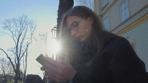 Young woman using smartphone Stock Footage 74186946